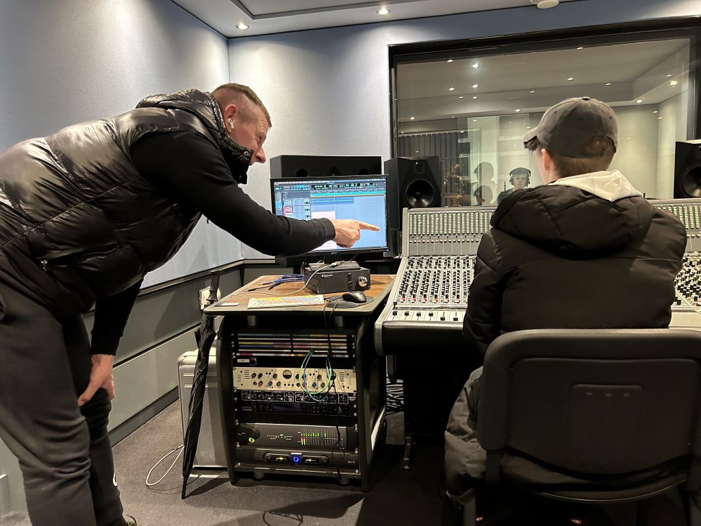 darren sumner offering guidance to a fellow student inside the futureworks studio